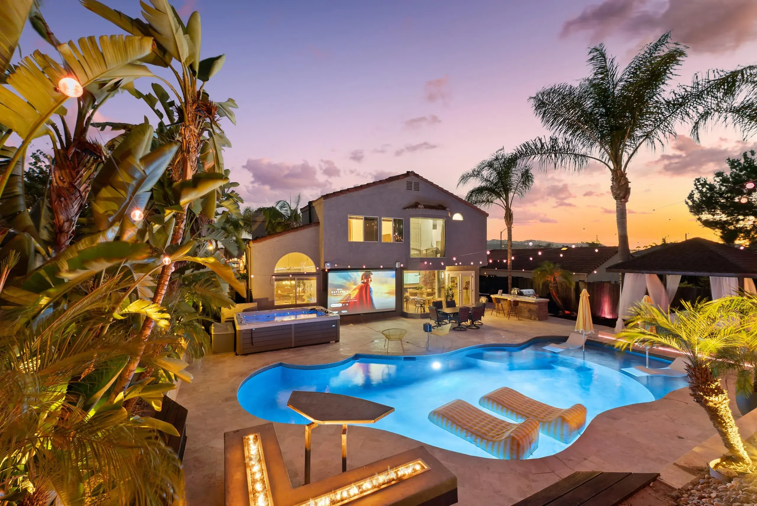 The private pool and palms at The Palms of SoCal at dusk